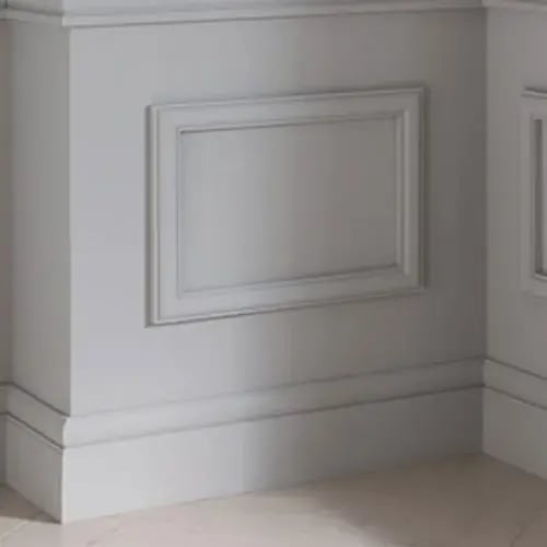 White wall panel moulding above a wide baseboard