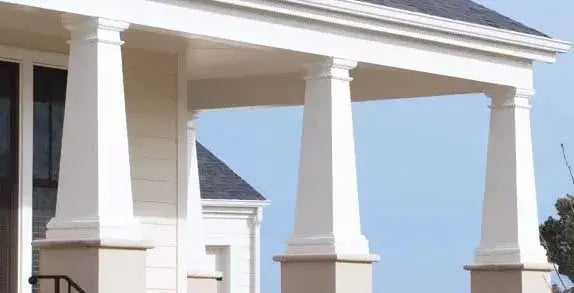 White tapered porch columns on square bases