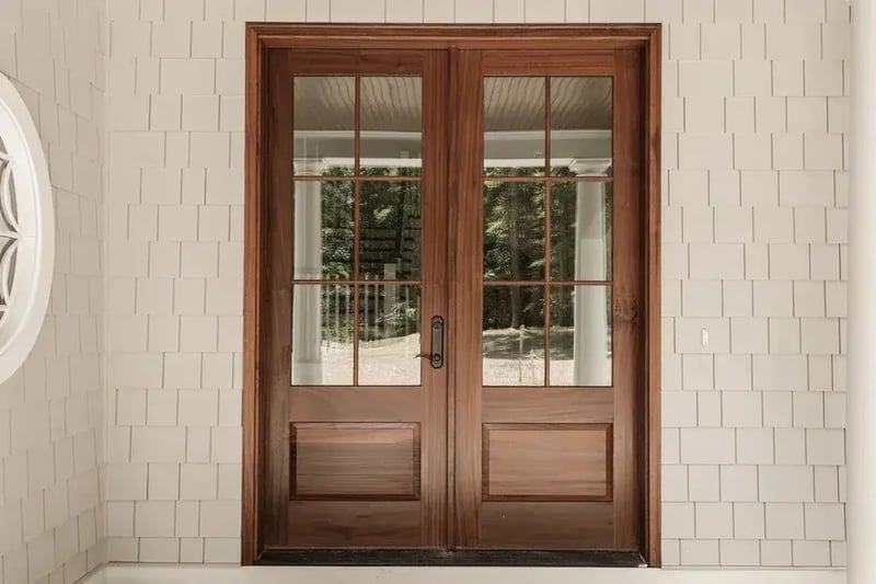 Wood double entry doors with divided glass panels